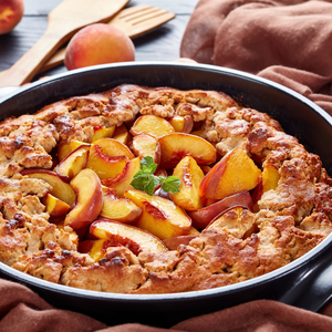 Savoureux dessert préparé avec des pêches Dixired bien fraîches, parfait pour une tarte maison